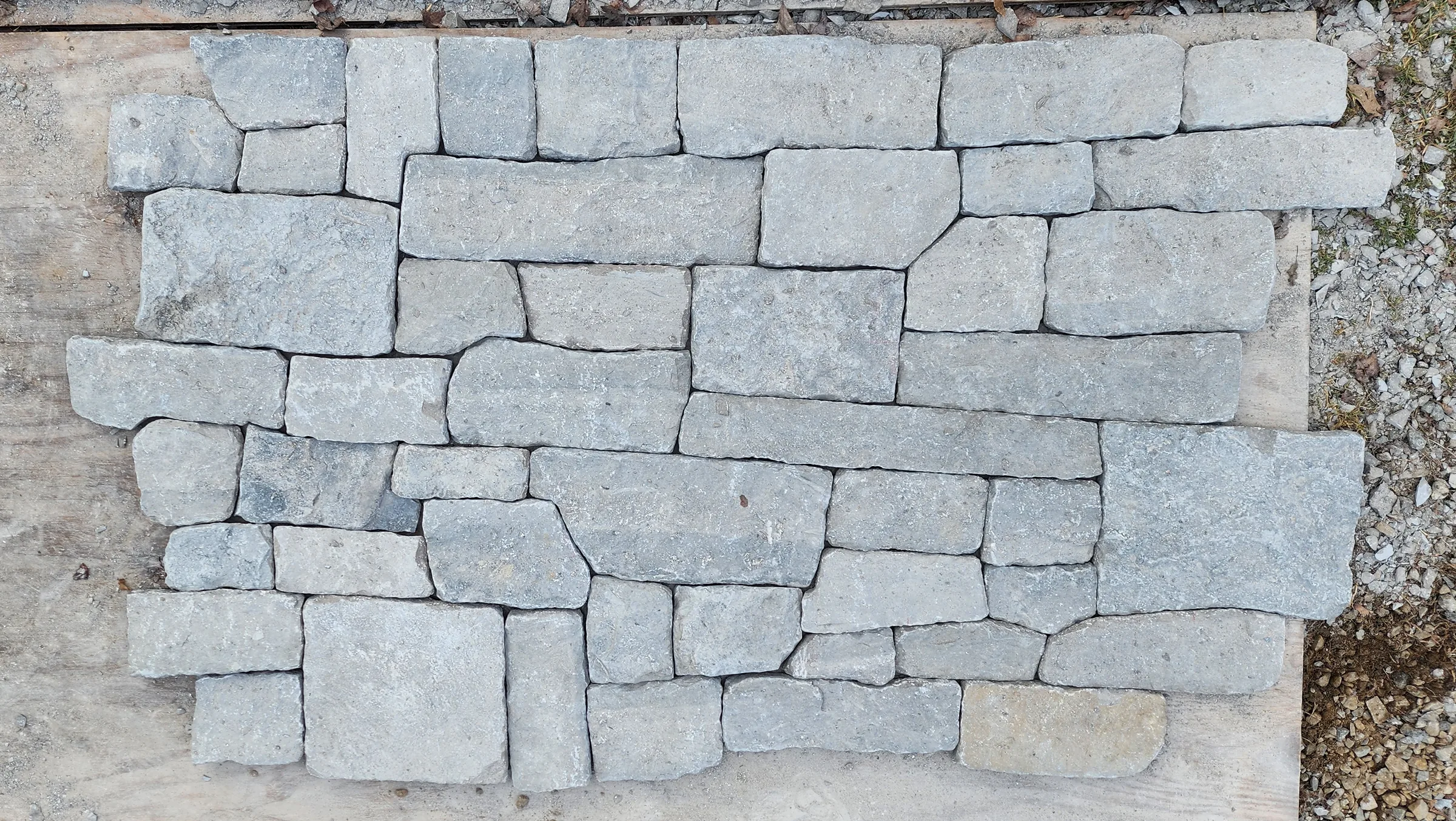 Stone samples laid out to refine coursing, scale, and color relationships