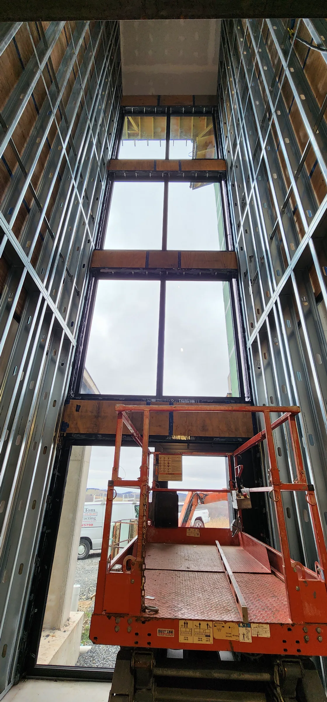 Lift within the tall framed central volume of the Modern Mountain House