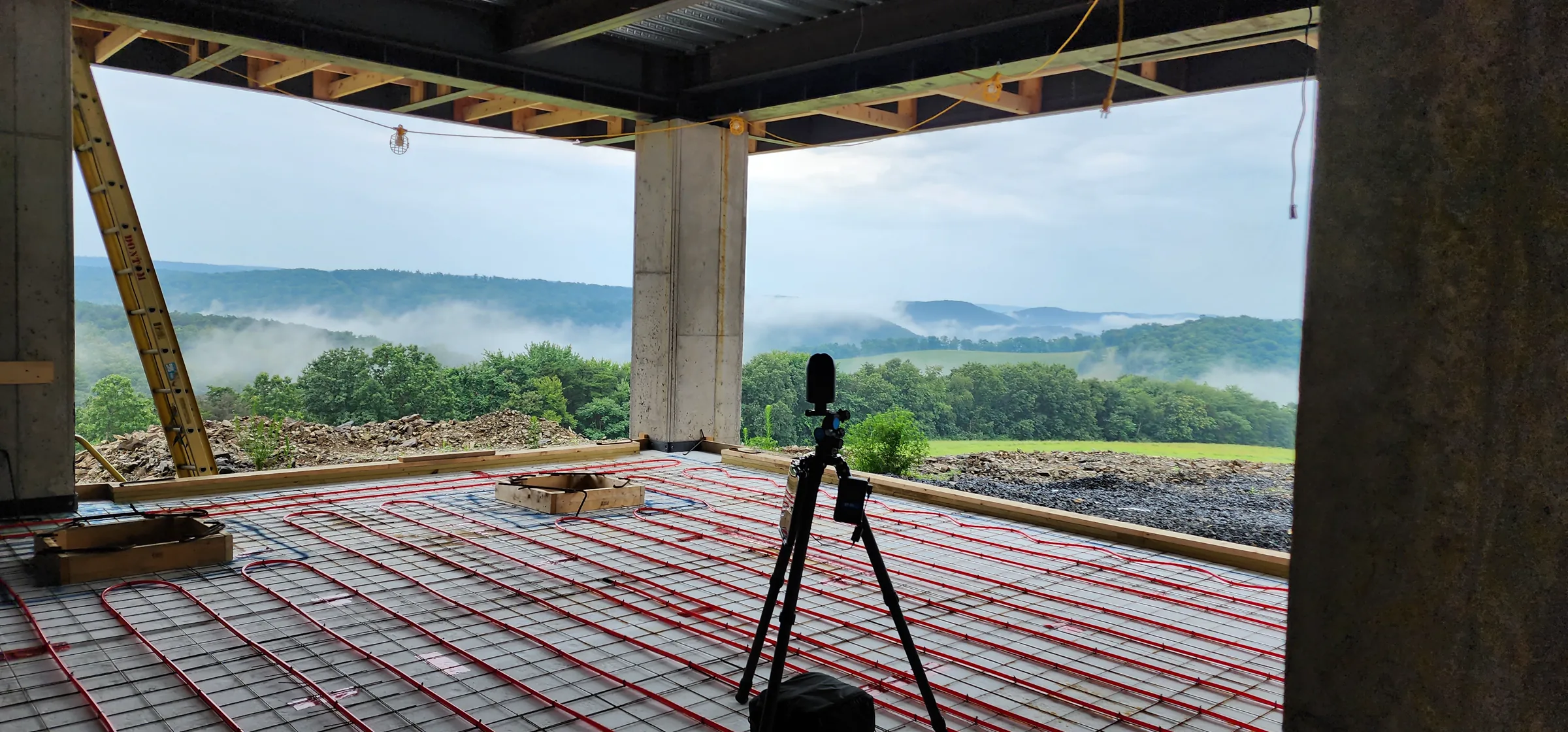 Steel frame and open interior deck of the Modern Mountain House facing the valley
