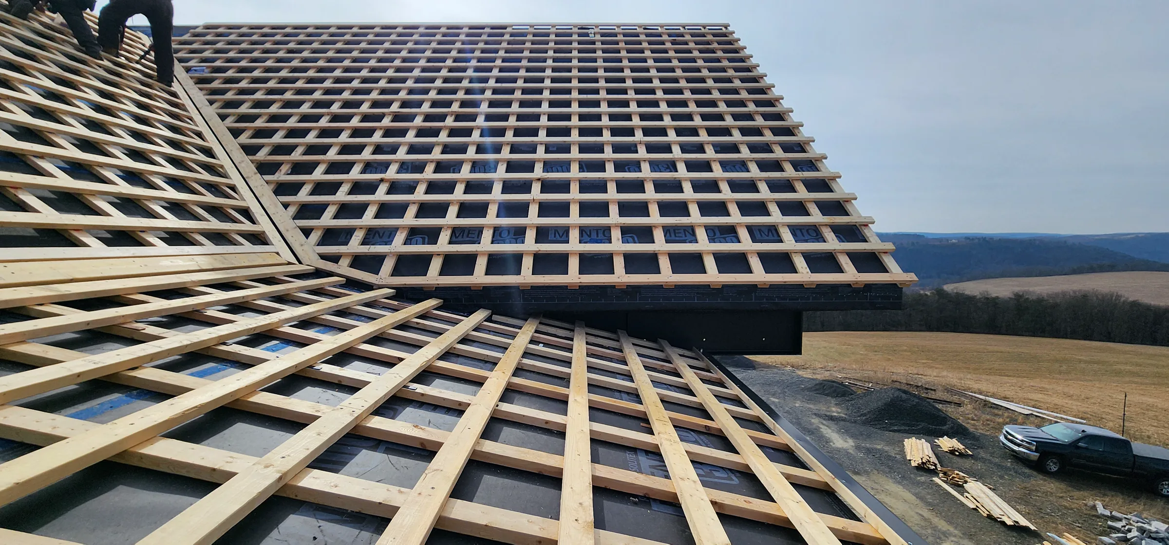 Roof battens crossing the intersecting roof planes of the Modern Mountain House