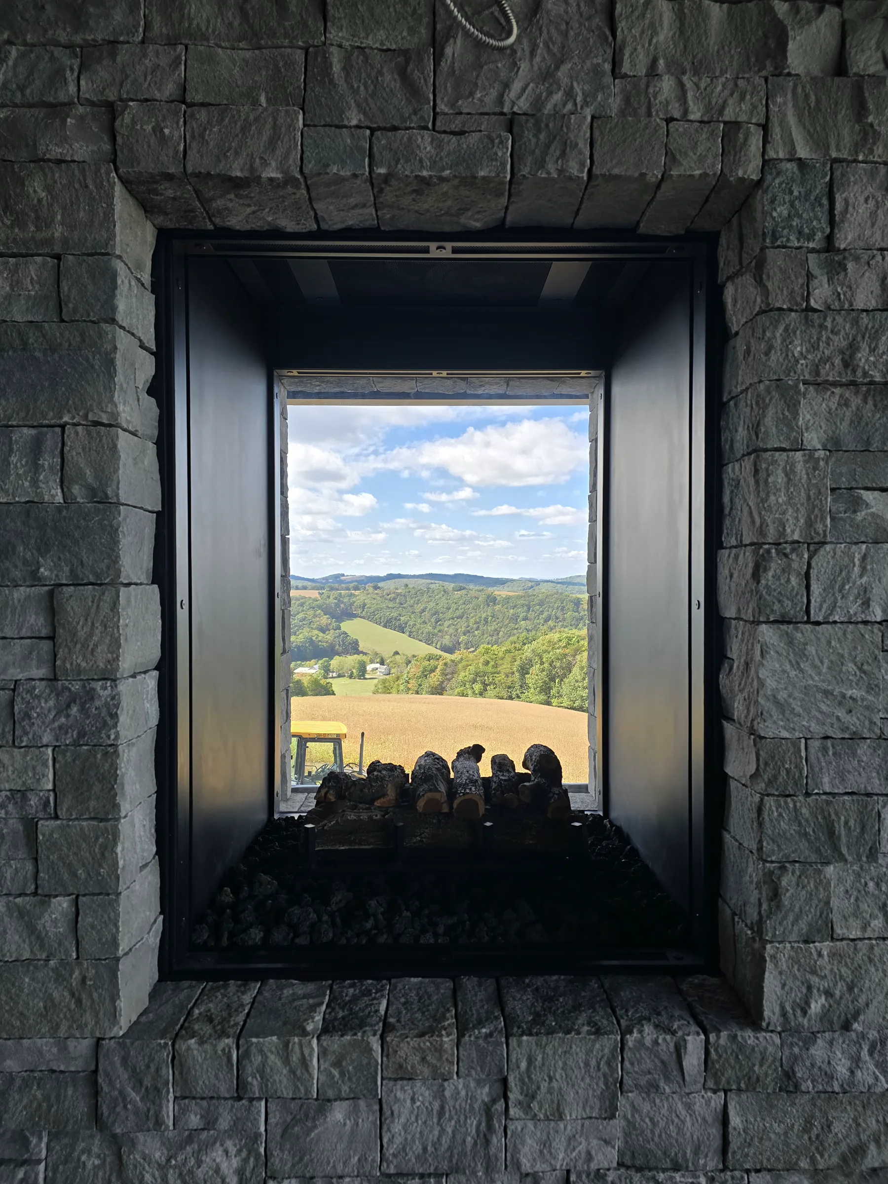 Deep stone window opening at the Modern Mountain House framing the Pennsylvania valley