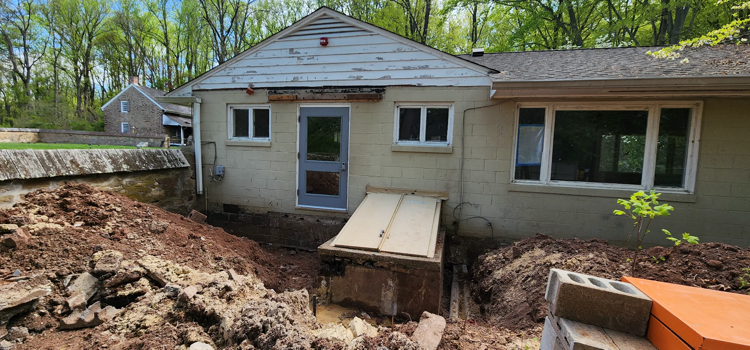 Excavated foundation trench and early framing at Friends First School