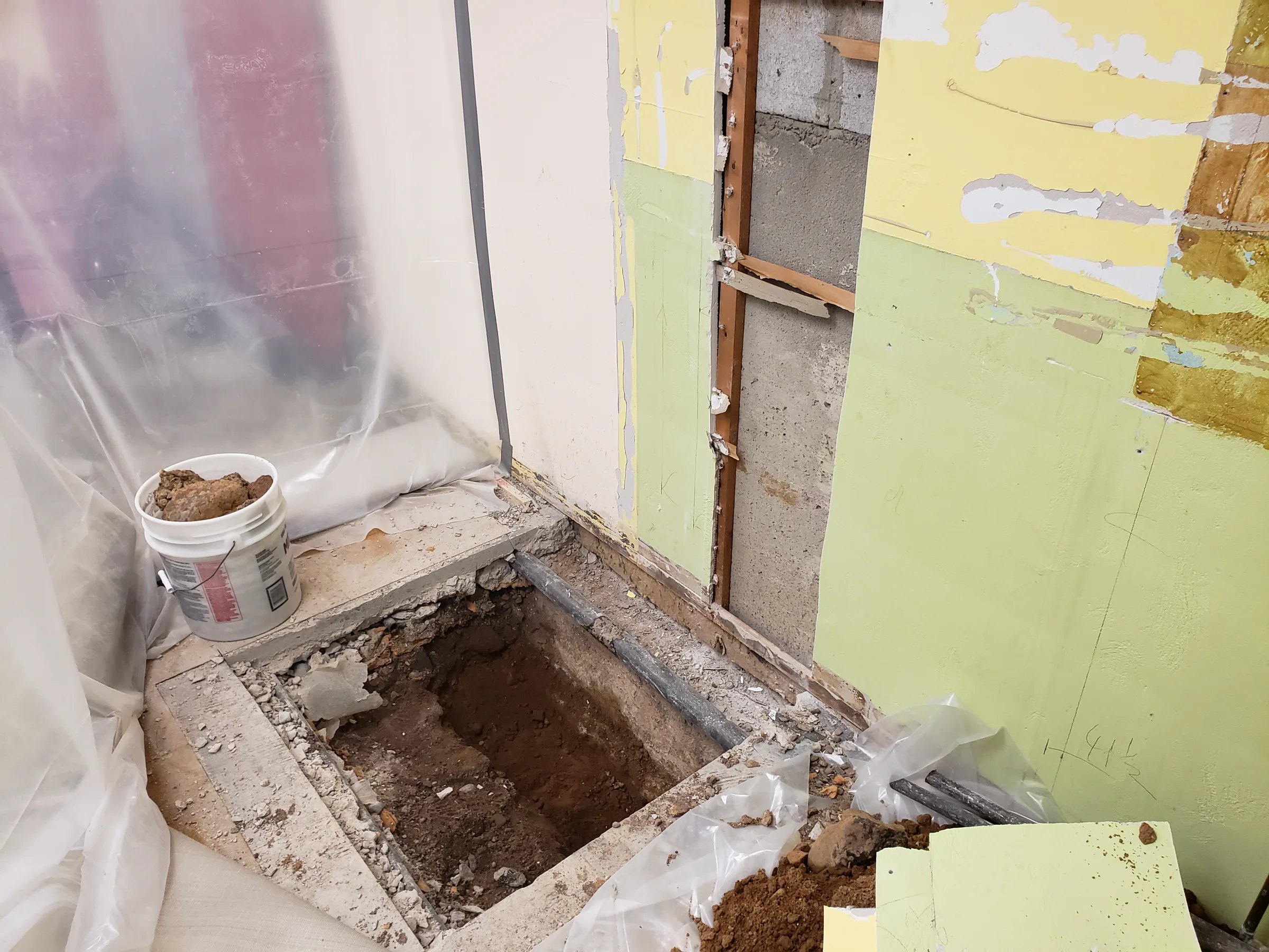 Interior demolition and plumbing rough-in during renovation work at Calvary Church